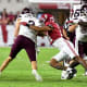 Alabama Crimson Tide defensive back Brian Branch (14) sacks Mississippi State Bulldogs quarterback Will Rogers (2) for a loss during the first half at Bryant-Denny Stadium.